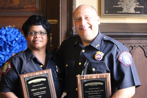 Honorees officer J McGhee and Captain Michael Kelly